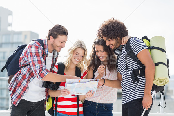 Stock photo: Friends looking at map