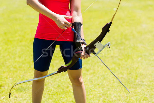 Mid-section of female athlete practicing archery Stock photo © wavebreak_media