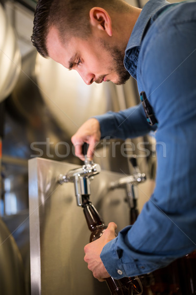 Brewer filling beer in bottle Stock photo © wavebreak_media