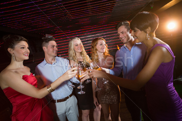 Group of friends toasting glasses of champagne Stock photo © wavebreak_media