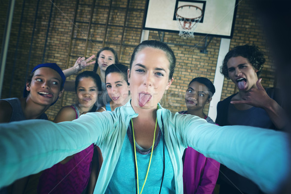 Portrait of female coach and high school kids taking a selfie Stock photo © wavebreak_media