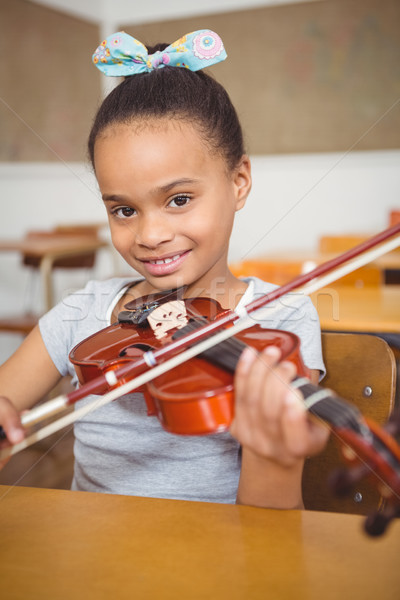 Student using a violin in class Stock photo © wavebreak_media