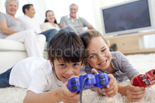 Stock fotó: Gyerekek · játszik · videojátékok · padló · család · kanapé