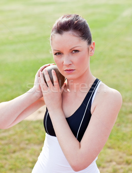 Determined female athlete ready to throw weight in a stadium Stock photo © wavebreak_media