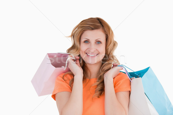 Happy blond-haired woman showing her shopping Stock photo © wavebreak_media