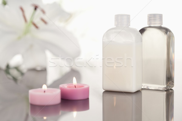 White orchid  glass phials and lighted pink candles Stock photo © wavebreak_media