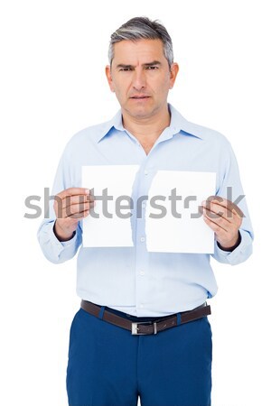 Portrait of a man holding a tablet computer against a white background Stock photo © wavebreak_media