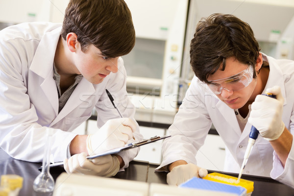 Male scientists making an experiment in a laboratory Stock photo © wavebreak_media