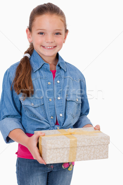 Portrait of a girl holding a gift box against a white background Stock photo © wavebreak_media