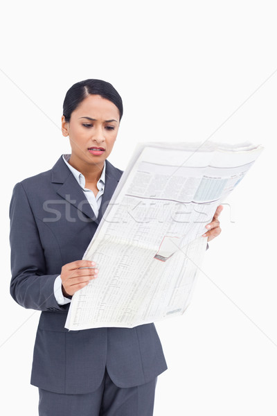 Close up of saleswoman reading the news against a white background Stock photo © wavebreak_media