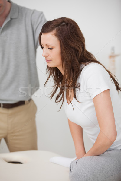 Woman stretching her leg while standing in a room Stock photo © wavebreak_media