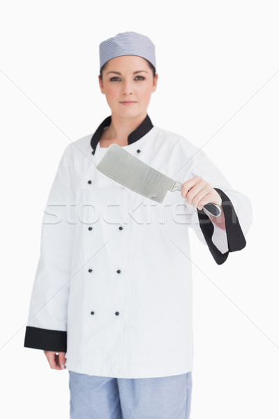 Serious cook holding a meat cleaver in front of camera Stock photo © wavebreak_media