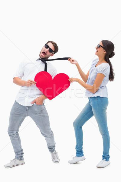 Brunette pulling her boyfriend by the tie Stock photo © wavebreak_media