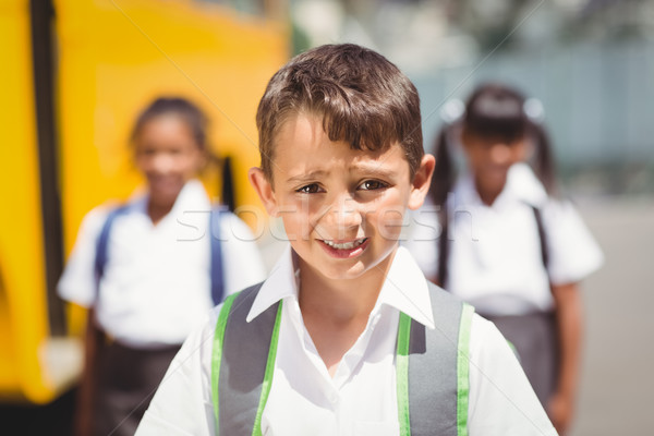 Cute souriant caméra bus scolaire à l'extérieur école élémentaire [[stock_photo]] © wavebreak_media