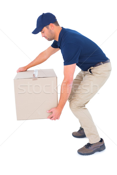 Courier man picking up cardboard box Stock photo © wavebreak_media