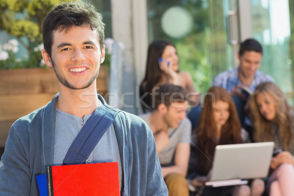 Happy student smiling at camera outside on campus Stock photo © wavebreak_media