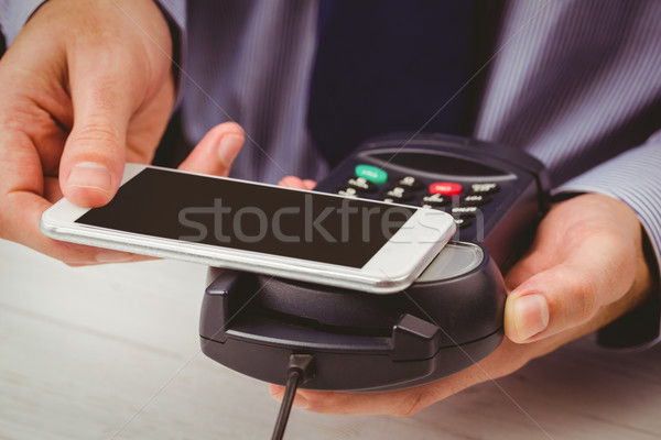 Man using smartphone to express pay  Stock photo © wavebreak_media