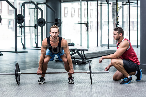 Portrait musculaire homme barbell entraîneur [[stock_photo]] © wavebreak_media