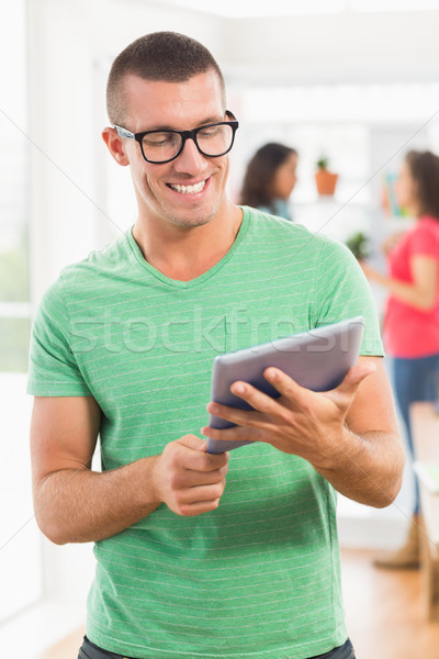 Smiling creative businessman looking at the camera Stock photo © wavebreak_media