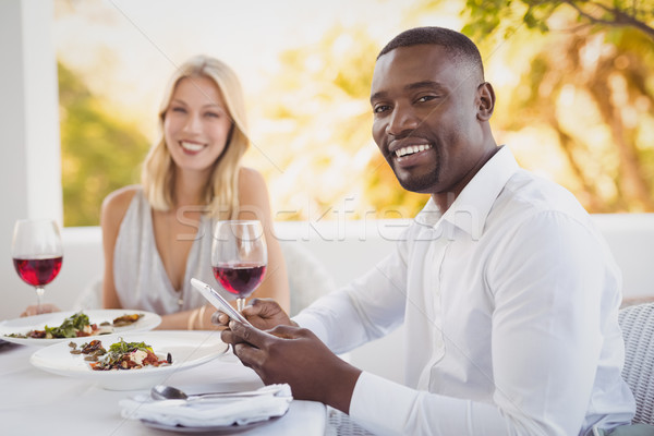 Stockfoto: Man · vervelen · vrouw · mobiele · telefoon · restaurant · voedsel