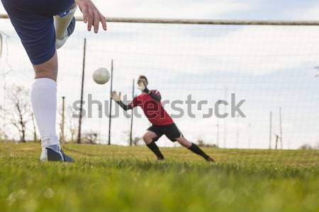 Full length of rugby player kicking ball for goal Stock photo © wavebreak_media