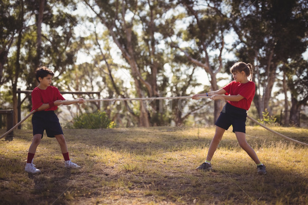 Determined kids practicing tug of war during obstacle course Stock photo © wavebreak_media