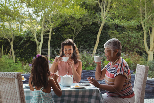 Famille heureuse thé maison alimentaire heureux enfant [[stock_photo]] © wavebreak_media