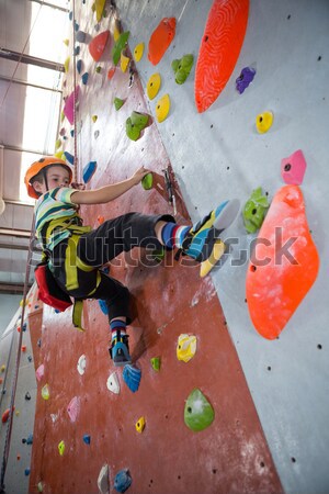 Determined woman practicing rock climbing Stock photo © wavebreak_media