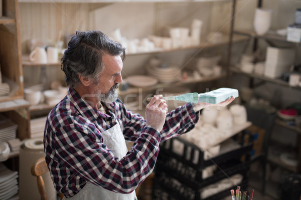 Male potter painting slab Stock photo © wavebreak_media