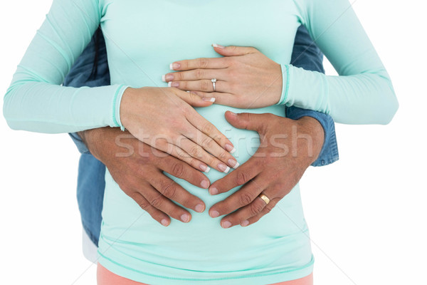 Man holding pregnant womans stomach Stock photo © wavebreak_media