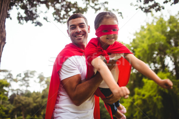 Father and daughter pretending to be a superhero  Stock photo © wavebreak_media