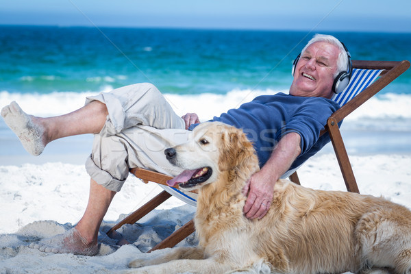 Stok fotoğraf: Olgun · adam · güverte · sandalye · köpek