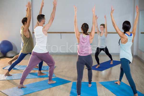 Stock photo: Group of people performing yoga
