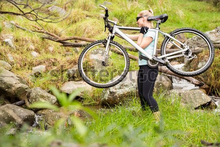 Biker Paar halten Mountainbike Fuß Wald Stock foto © wavebreak_media