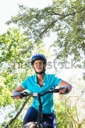 Femminile montagna bicicletta foresta Foto d'archivio © wavebreak_media