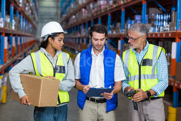 Warehouse workers interacting with each other Stock photo © wavebreak_media