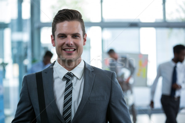 Smiling businessman in office Stock photo © wavebreak_media