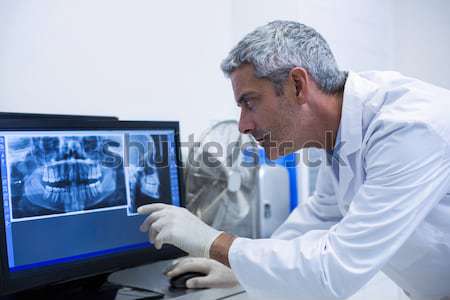 Doctor using patient monitoring machine in ward Stock photo © wavebreak_media