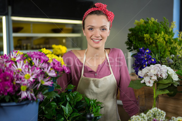 Happy female florist standing in flower shop Stock photo © wavebreak_media