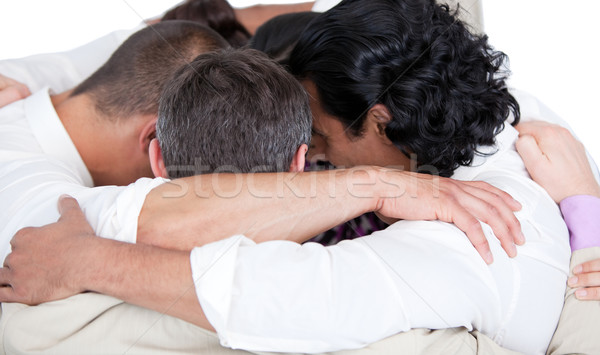 Confident business team hugging each other in a circle  Stock photo © wavebreak_media