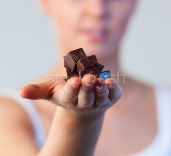 Close-up of an attractive woman holding chocolate focus on chocolate  Stock photo © wavebreak_media