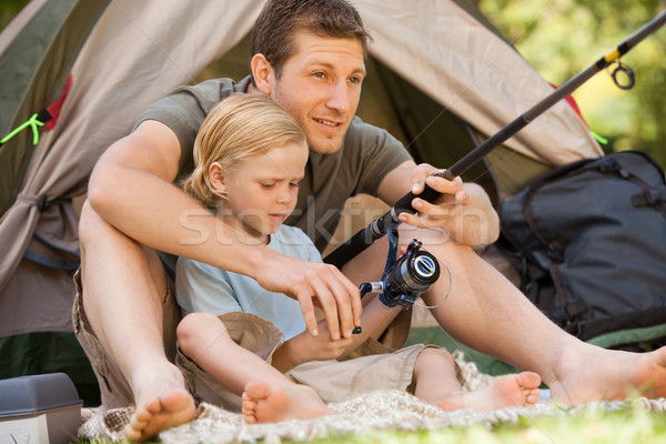 Père pêche fils fille herbe vert [[stock_photo]] © wavebreak_media