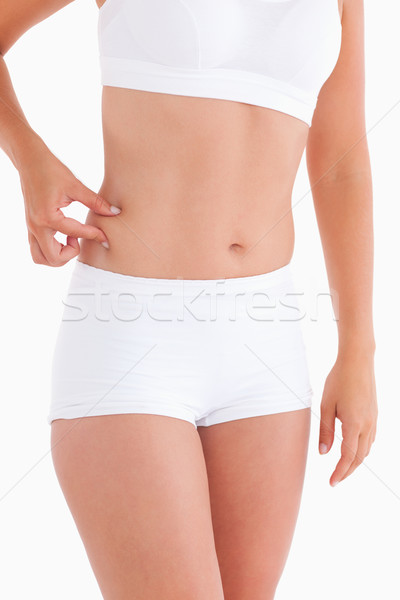 Delgado mujer agarrar cintura estudio sonrisa Foto stock © wavebreak_media