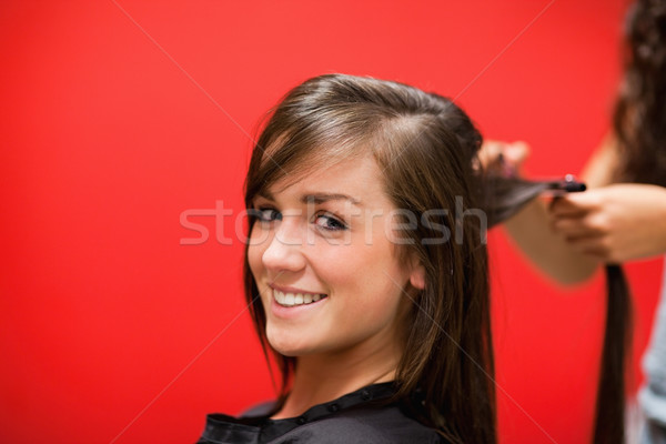 Genç kadın saç bakıyor kamera iş moda Stok fotoğraf © wavebreak_media