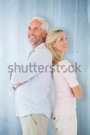Portrait of happy business people back to back against white background Stock photo © wavebreak_media