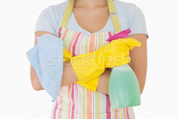 Woman holding window cleaner and rag wearing apron and rubber gloves Stock photo © wavebreak_media