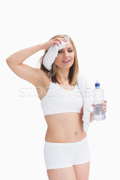 Femeie sticla de apa sudoare prosop Imagine de stoc © wavebreak_media