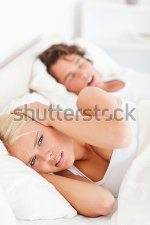 Asleep woman with focus on spilt bottle of pills at home Stock photo © wavebreak_media