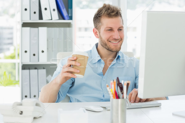 улыбаясь человека рабочих столе питьевой Сток-фото © wavebreak_media