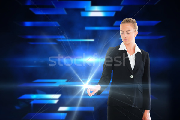 Blonde businesswoman touching light Stock photo © wavebreak_media